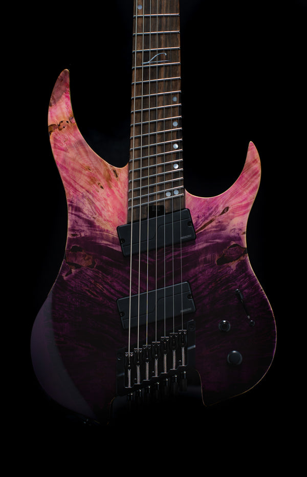 Legator Ghost 7 String Guitar, X Series. Thru-neck construction, Fishman Fluence Pickups. Kill Switch. Fan Frets. Black or Gold Hardware. Includes Deluxe Gig Bag. Ruby.